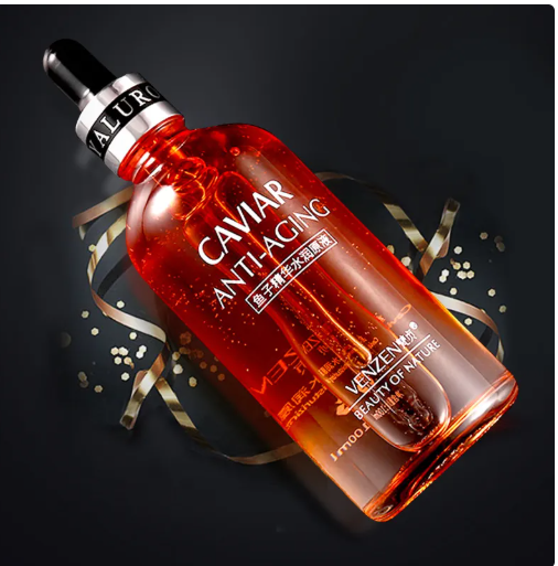Applying 24K gold firming serum to skin